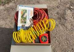 Flat with extension cords, power strip, tape measures, air hose