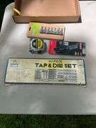 Flat of tap & die set, utility knife, tape measure, bits