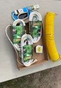 Flat of extension cords, power strips, tape measures, air hose