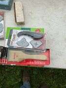 Tote of misc gardening, spickets, brass handles, paint trays