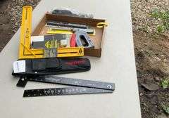Flat with craftsman holding framer, oil filler, stapler grill lighters