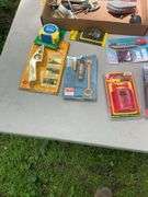 Flat of chalk line, utility knives, thread taps, misc