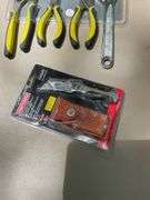 Flat of craftsman ratchets, utility knife, pliers