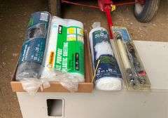 3 rolls of plastic and a work light