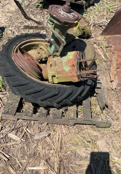 Pallet of John Deere H rear axles, w/tire & rim & small front wheel rim, JD
