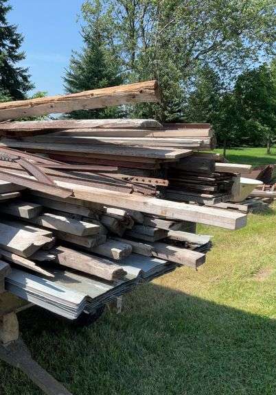 Assortment of Lumber and Large Timbers , 18 sheets of 19ft roof steel.