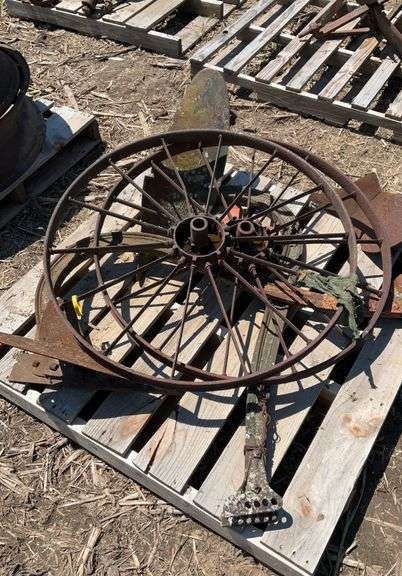 pallet of (2) metal flat spoke wheels, 3ft diameter, & (2) one bottom plows
