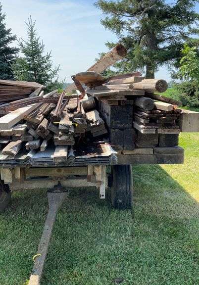 Assortment of Lumber and Large Timbers , 18 sheets of 19ft roof steel.
