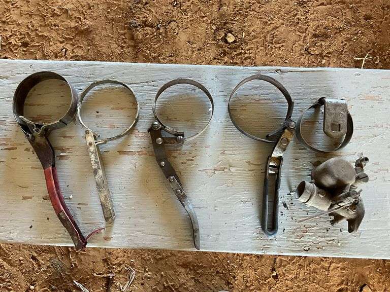 Flat of oil filter wrench and carburetor