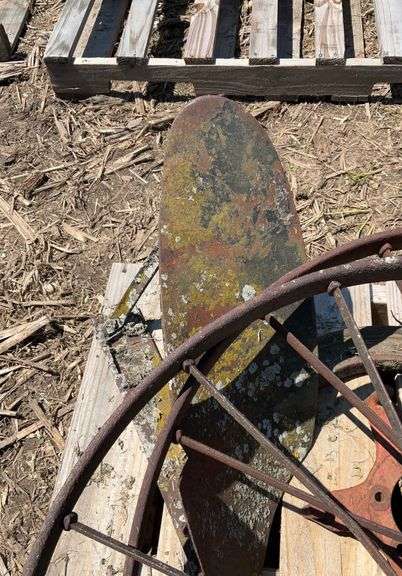 pallet of (2) metal flat spoke wheels, 3ft diameter, & (2) one bottom plows
