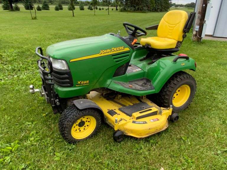 John Deere X595 Lawn Mower, 1,577 Hours, w/62” Deck, 4x4, Front Grill, Side