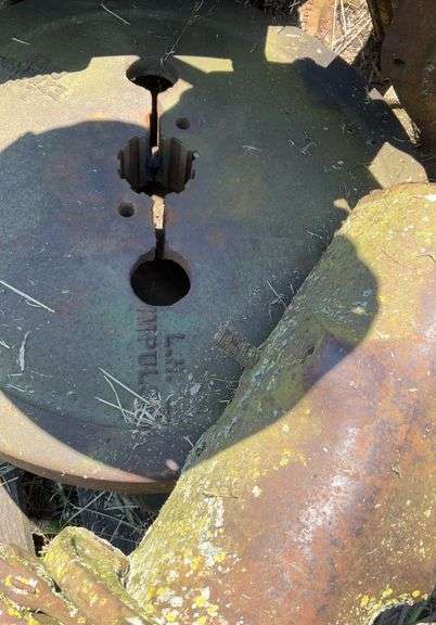 Pallet of John Deere H rear axles, w/tire & rim & small front wheel rim, JD