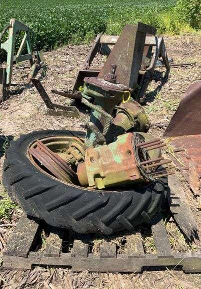 Pallet of John Deere H rear axles, w/tire & rim & small front wheel rim, JD