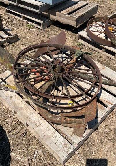 pallet of (2) metal flat spoke wheels, 3ft diameter, & (2) one bottom plows