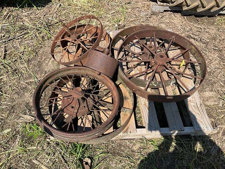 (2) 28" iron wheels w/hubs & misc pulleys & wheels