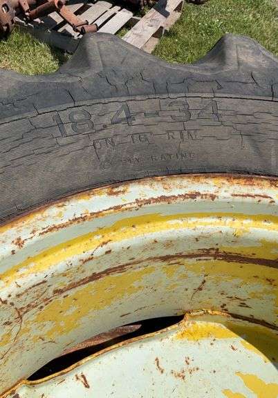 2- 18.4-34 tires axle mount rims, 9 bolt