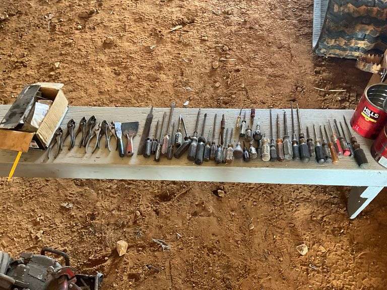 4 coffee cans of screwdrivers, pliers, and box of nails