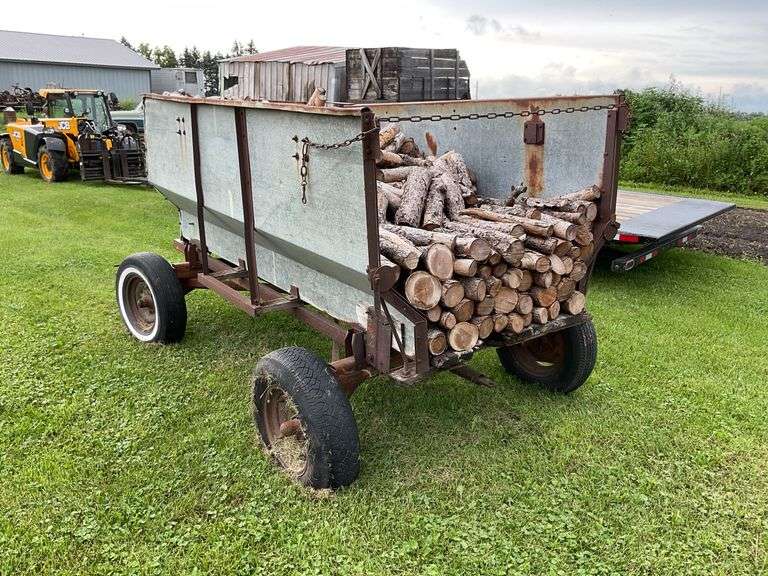 Walsh metal flare box on running gear w/ firewood