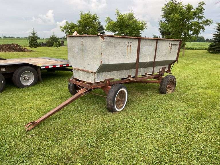 Walsh metal flare box on running gear w/ firewood