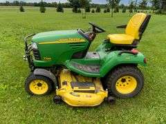 John Deere X595 Lawn Mower, 1,577 Hours, w/62” Deck, 4x4, Front Grill, Side