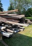 Assortment of Lumber and Large Timbers , 18 sheets of 19ft roof steel.