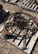 pallet of (2) metal flat spoke wheels, 3ft diameter, & (2) one bottom plows