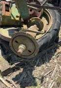 Pallet of John Deere H rear axles, w/tire & rim & small front wheel rim, JD