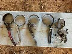 Flat of oil filter wrench and carburetor