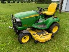 John Deere X595 Lawn Mower, 1,577 Hours, w/62” Deck, 4x4, Front Grill, Side
