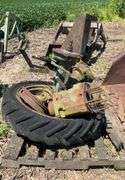 Pallet of John Deere H rear axles, w/tire & rim & small front wheel rim, JD