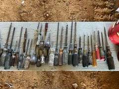 4 coffee cans of screwdrivers, pliers, and box of nails