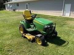 John Deere X595 Lawn Mower, 1,577 Hours, w/62” Deck, 4x4, Front Grill, Side