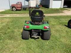 John Deere X595 Lawn Mower, 1,577 Hours, w/62” Deck, 4x4, Front Grill, Side