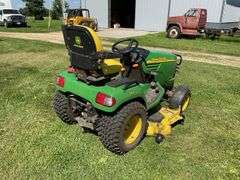 John Deere X595 Lawn Mower, 1,577 Hours, w/62” Deck, 4x4, Front Grill, Side