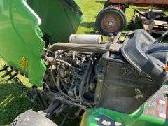 John Deere X595 Lawn Mower, 1,577 Hours, w/62” Deck, 4x4, Front Grill, Side