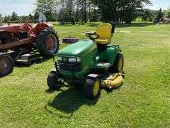 John Deere X595 Lawn Mower, 1,577 Hours, w/62” Deck, 4x4, Front Grill, Side