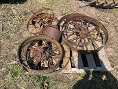 (2) 28" iron wheels w/hubs & misc pulleys & wheels