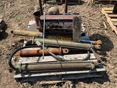 Pallet of hydraulic cylinders, pulleys & large buzz saws