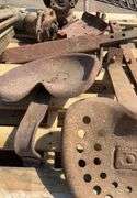 Tractor seats and drawbars