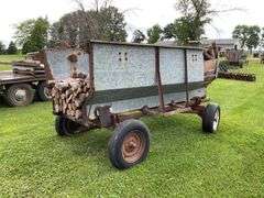 Walsh metal flare box on running gear w/ firewood