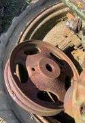Pallet of John Deere H rear axles, w/tire & rim & small front wheel rim, JD
