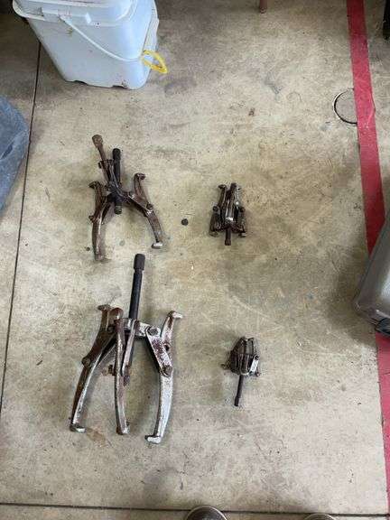 Pail of gear  pullers various sizes