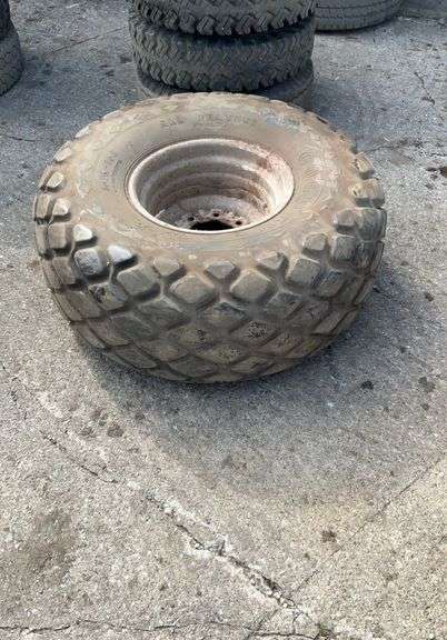 (1) 16.5-16.1 tire on 8 bolt rim