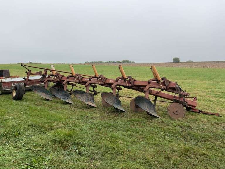 International 710 semi mounted 5 bottom plow with colters