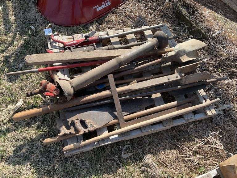 Pallet containing PTO shaft, barrel pumps, long handle tools