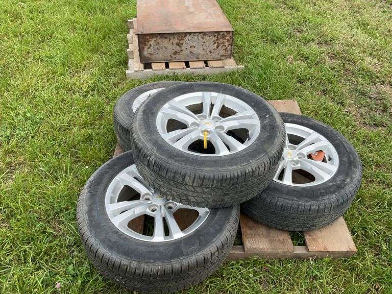 Rims and tires from a 2016 Chevy Equinox with lug nuts