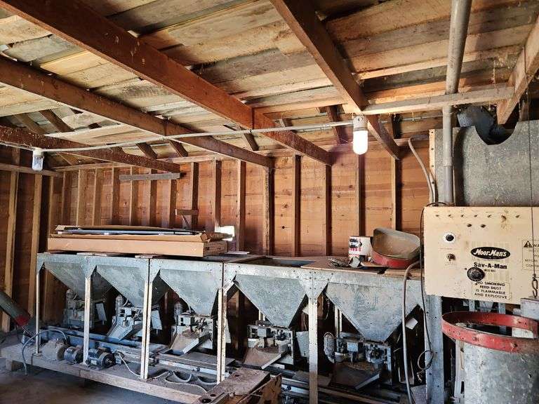Moormans Sav-A-Man Hammermill with 5 Bay Mixing Station and Unload Auger