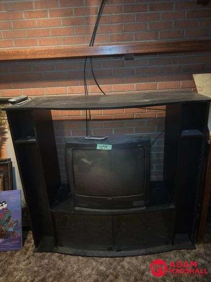 Entertainment Center and TV Measures 54 by 20 by 49.  TV 25 In