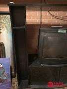 Entertainment Center and TV Measures 54 by 20 by 49.  TV 25 In