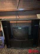 Entertainment Center and TV Measures 54 by 20 by 49.  TV 25 In